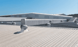 Commercial metal roof replacement and restoration on a large building
